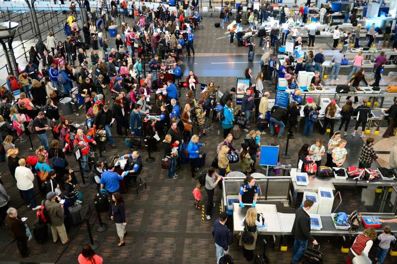 Travelers make their way through security lines at Denver International Airport, November 27, 2013.
