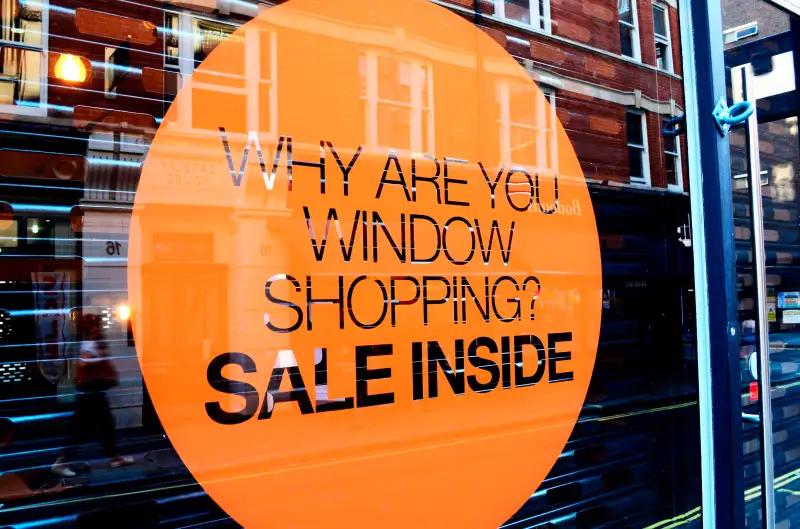 Why are you window shopping? Sale inside sign on store window