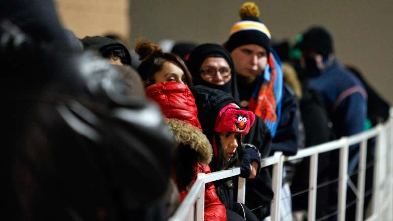 Customers wait in line outside a Target Corp. store ahead of Black Friday in Chicago, Illinois, U.S., on Thursday, Nov. 28, 2013.