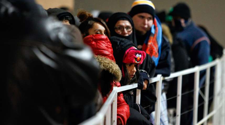 Customers wait in line outside a Target store ahead of Black Friday in Chicago, Illinois.