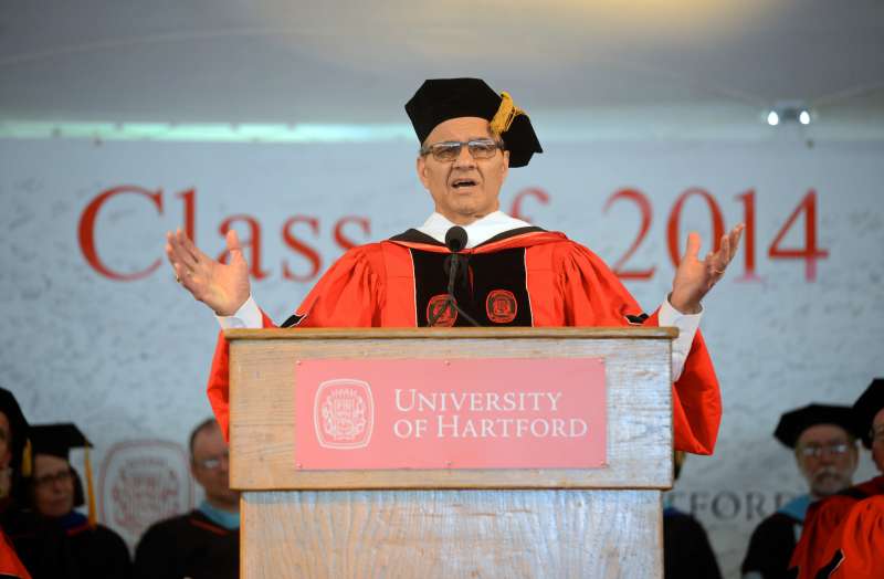 In this photo provided by the University of Hartford, former New York Yankees manager Joe Torre gestures after receiving an honoroary degree during commencement ceremonies at the University of Hartford in West Hartford, Conn., Sunday, May 18, 2014.
