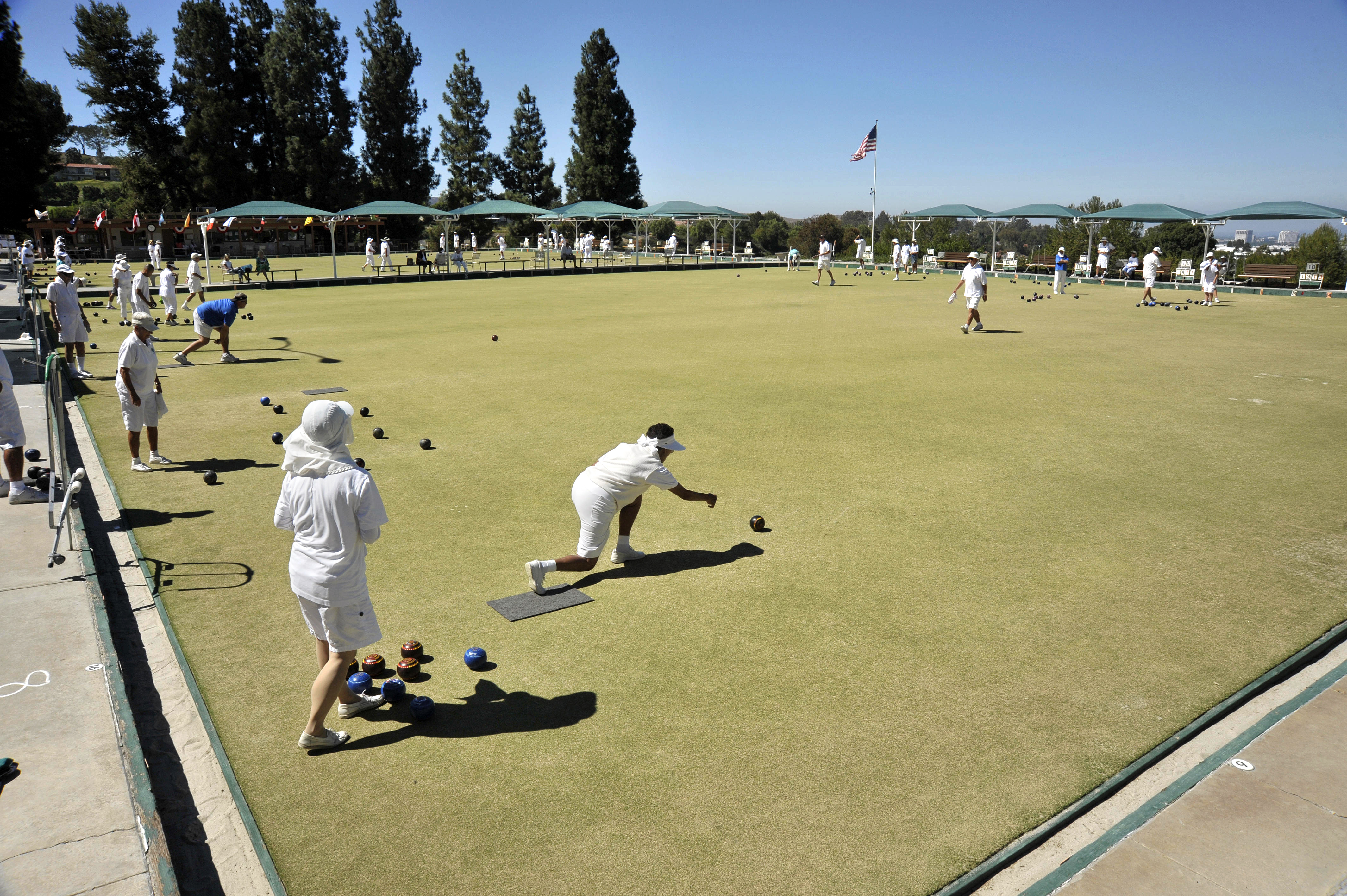 Lawn bowlers, from Laguna Woods and around Southern California, compete in a tournament at Clubhouse 2 on Sunday afternoon.