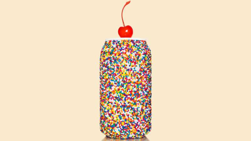 soda can with sprinkles and a cherry on top