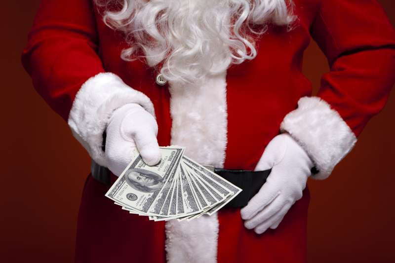 Santa showing fan of $100 bills