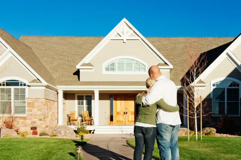 young couple admiring their new home