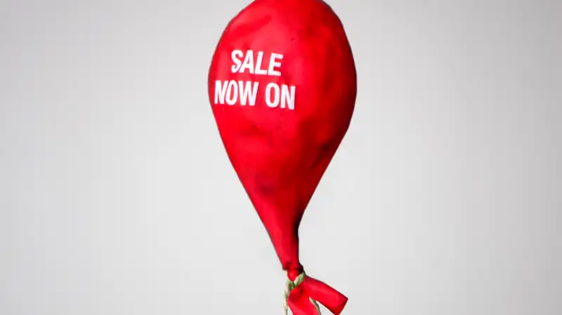 deflated balloon saying Sale Now On
