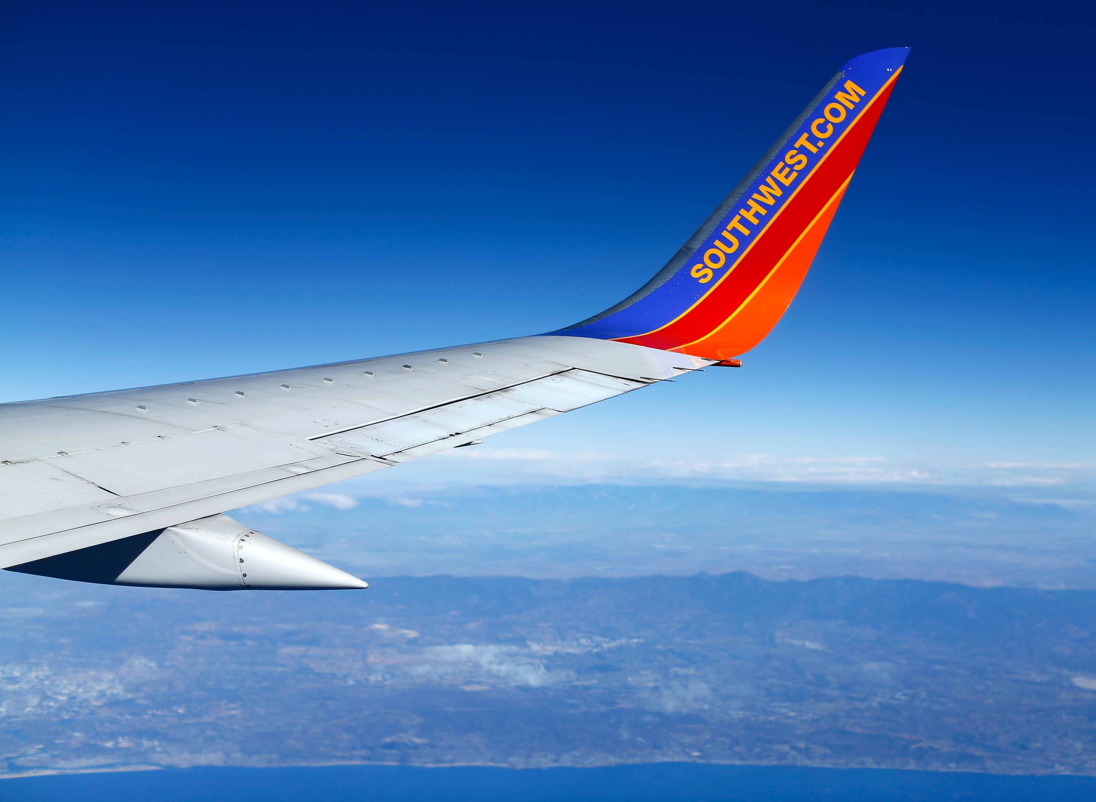 The wing of a Southwest commercial airliner during a flight over the Pacific Ocean near Los Angeles, California, November 19, 2014.