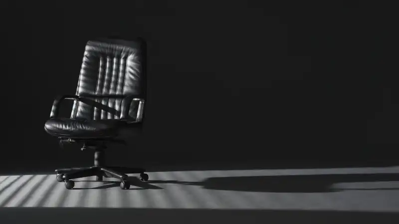 empty office chair in shadows