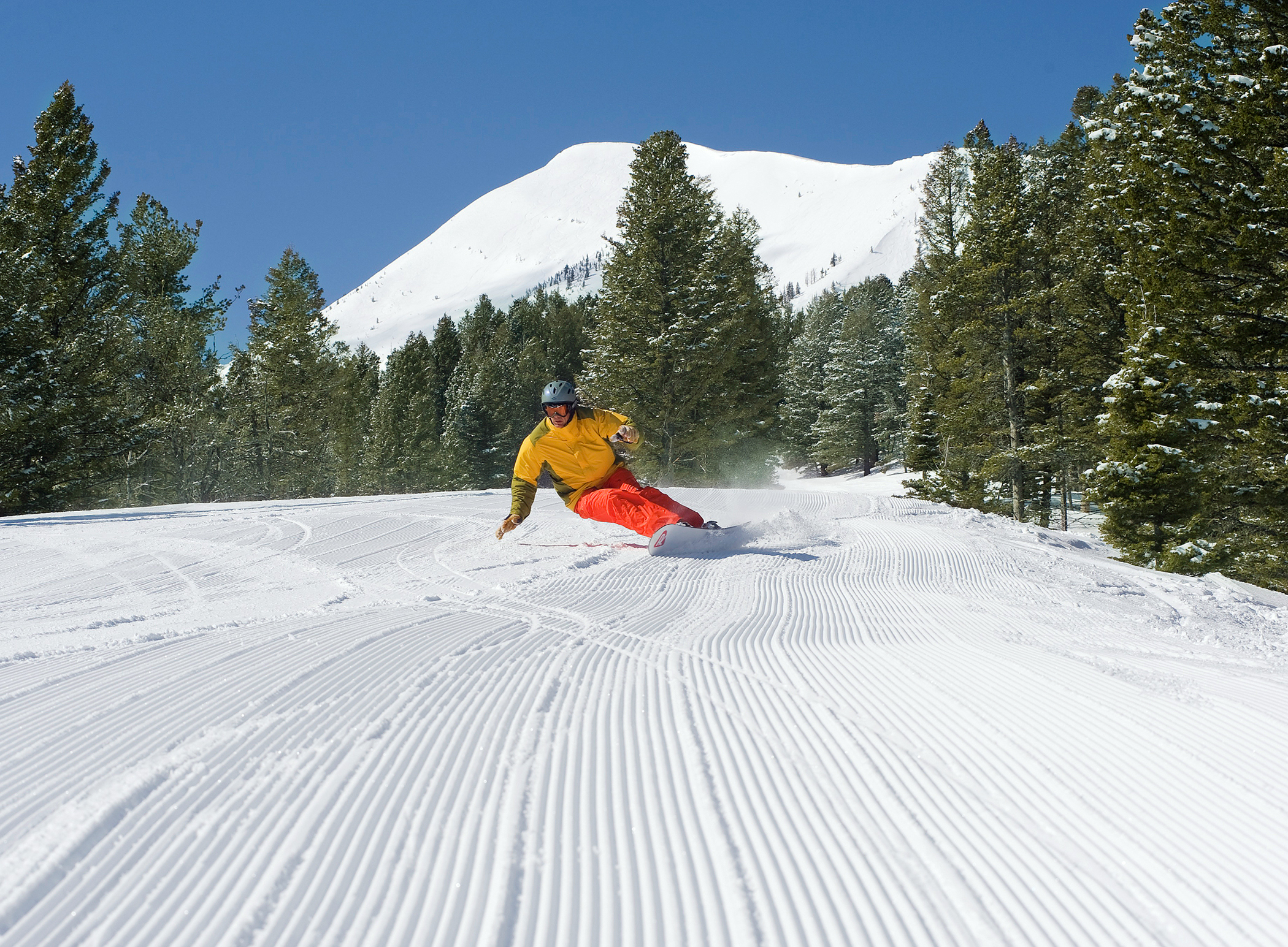 A snowboarder enjoys the fresh powder at Montana's Bridger Bowl