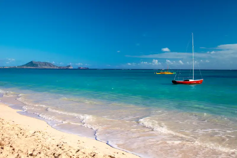 Lanikai, which translates to,  Heavenly Sea,  is a beautiful sandy beach on the windward side of Oahu, located about 30 minutes from downtown Honolulu.