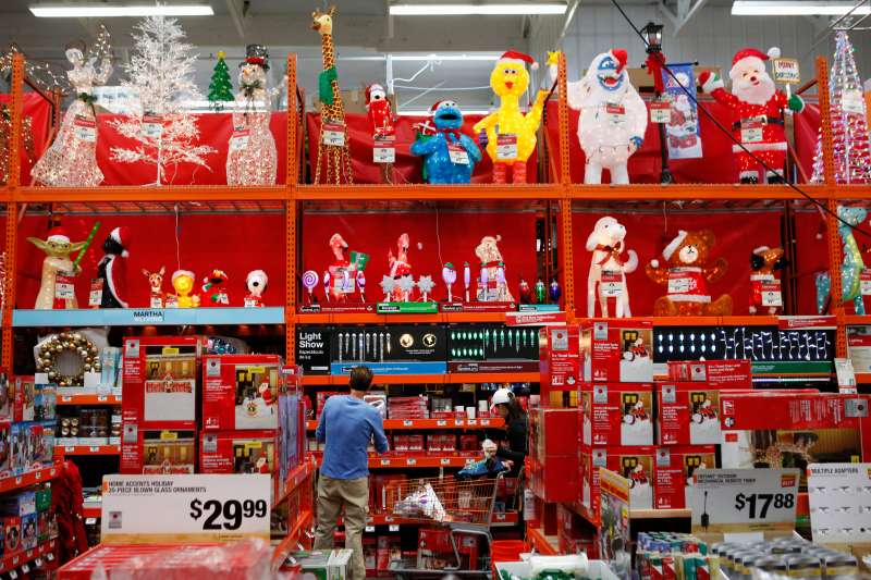 Customers browse Christmas decorations while shopping at a Home Depot Inc. store in Torrance, California, U.S.
