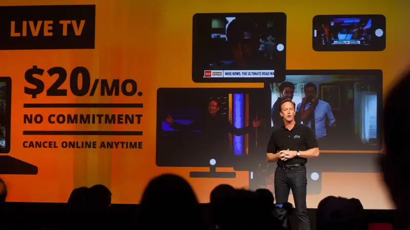 Roger Lynch, chief executive officer for Sling TV LLC, speaks at a press conference during the 2015 Consumer Electronics Show (CES) in Las Vegas, Nevada, U.S., on Monday, Jan. 5, 2015. Dish Network Corp. plans to unveil the first major online television service from a cable or satellite company, a $20-a-month set of 12 channels that targets U.S. customers who don't want to pay for larger, more expensive TV packages. ]