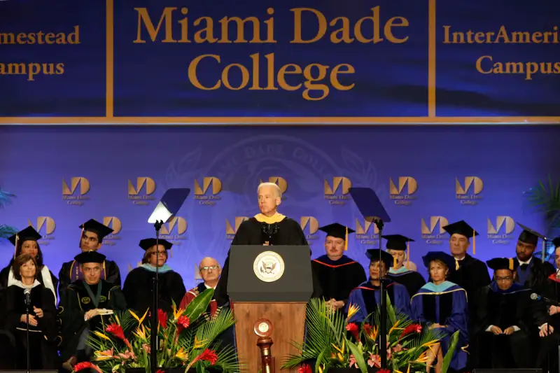 Vice President Joe Biden, center, speaks during a graduation ceremony at the Miami Dade College in Miami, Saturday, May 3,2014.