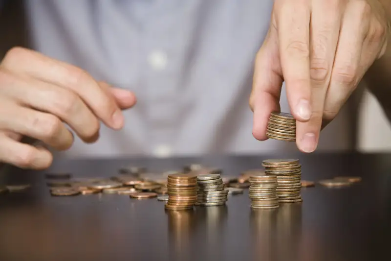 man counting coins