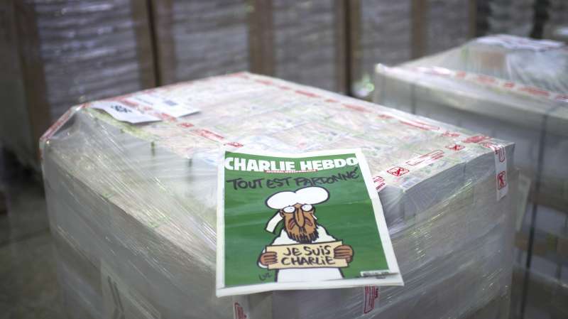 The weekly newspaper Charlie Hebdo, on January 13, 2015 in Villabe, south of Paris, a week after two jihadist gunmen stormed the Paris offices of the satirical magazine, killing 12 people including some of the country's best-known cartoonists. Its cover features the prophet with a tear in his eye, holding a  Je Suis Charlie  sign under the headline  All is forgiven .