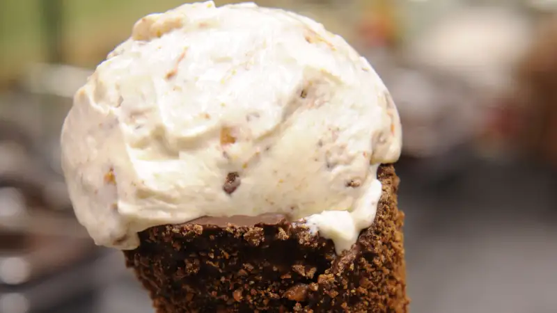 Ice Cream cone filled with Maple Ice Cream Graham Crackers Skor Bar in Dark Chocolate and Skor Cone at Marble Slab Creamery.