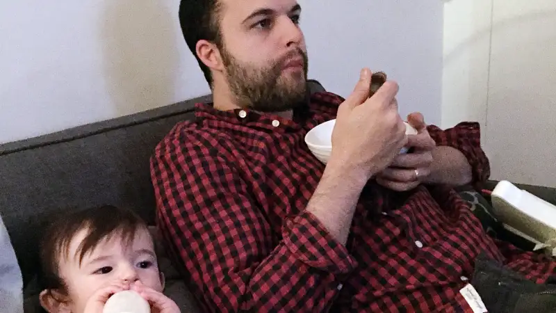 Father and son sharing a meal.