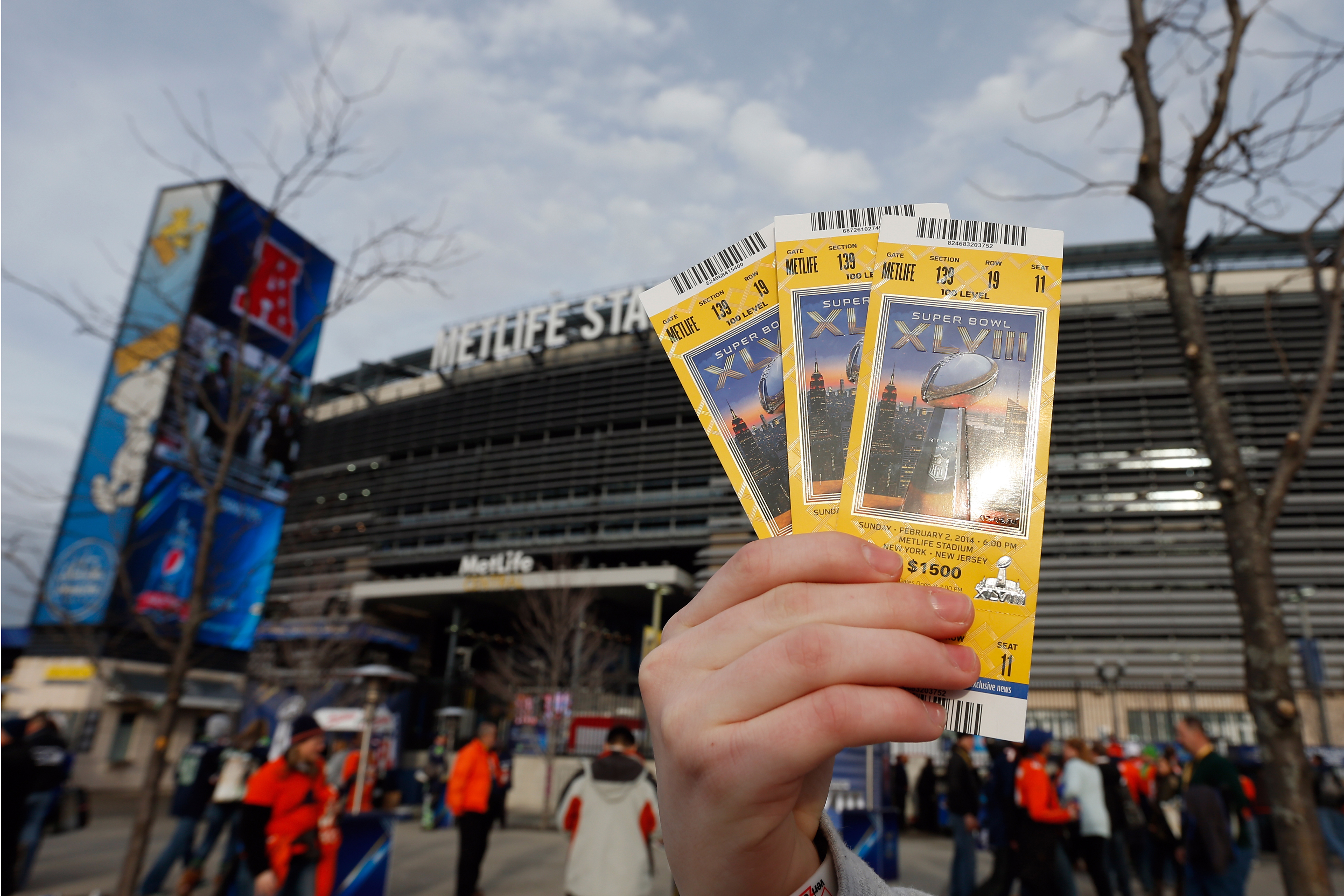 A general view of the exterior of MetLife Stadium as a fan holds his Super Bowl XLVIII ticket prior to the Super Bowl XLVIII game between the Seattle Seahawks against the Denver Broncos in East Rutherford, New Jersey on Sunday, February 2, 2014. The Seahawks defeated the Broncos 43-8.