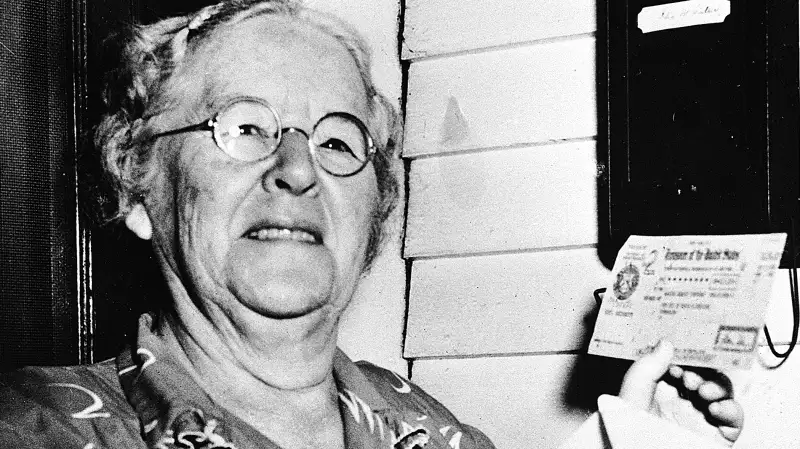 In this Oct. 4, 1950 file photo, Ida May Fuller, 76, displays a Social Security check for $41.30 that she received at her home in Ludlow Vt. On Jan. 31, 1940, Fuller received the country's first Social Security check for $22.54. By the time she died in 1975 at age 100, she had received nearly $23,000 in benefits.