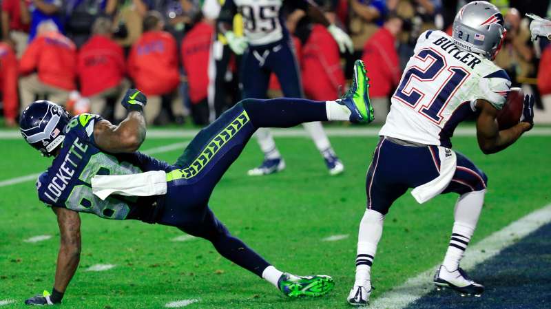 Malcolm Butler #21 of the New England Patriots intercepts a pass by Russell Wilson #3 of the Seattle Seahawks intended for Ricardo Lockette #83 late in the fourth quarter during Super Bowl XLIX at University of Phoenix Stadium on February 1, 2015 in Glendale, Arizona.