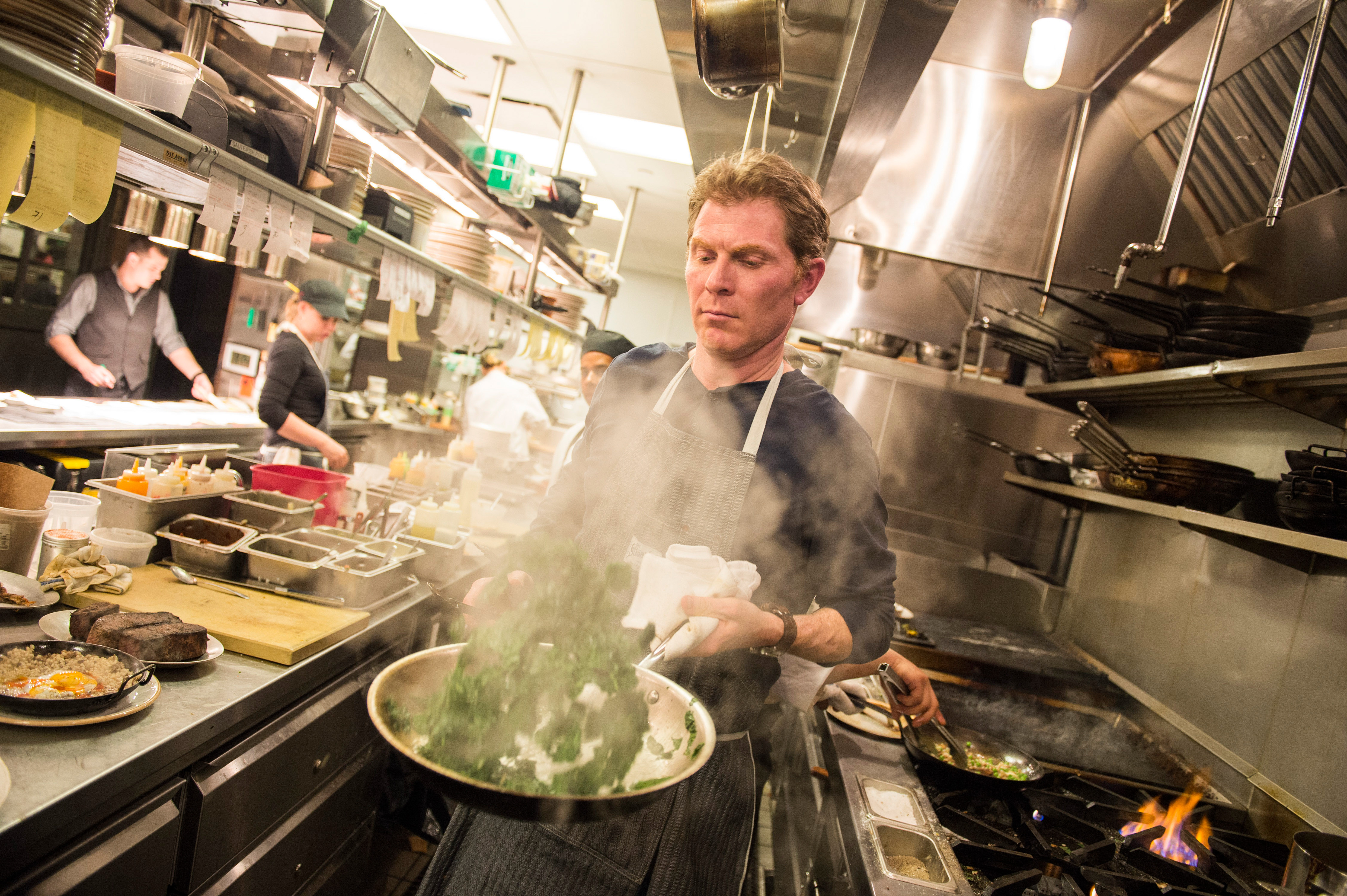 Bobby Flay works the line at Gato, his new restaurant, rated No. 9 on the New York Times' year-end list of the city's best new restaurants, on June 3, 2014.