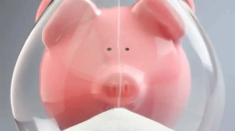 piggy bank and hourglass