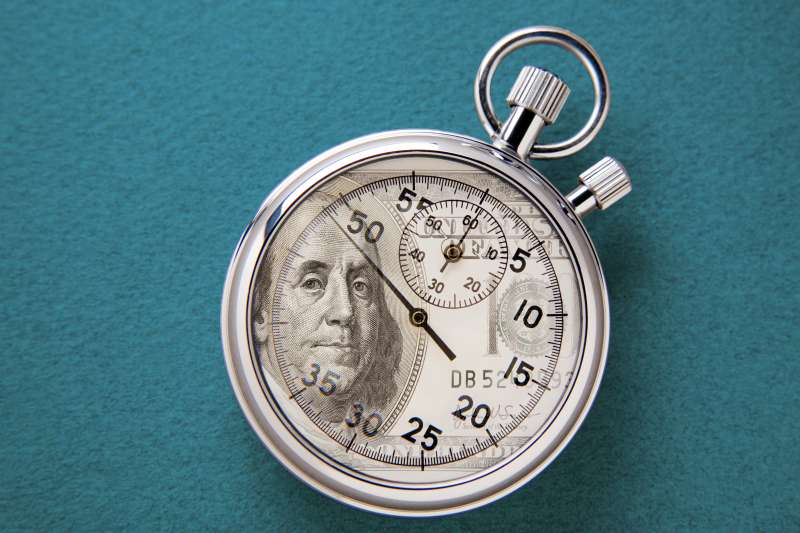 stopwatch with money/dollar on it