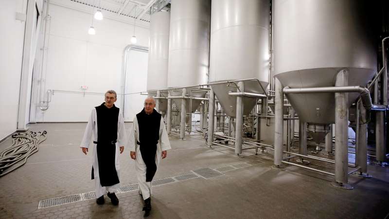 In this Thursday, Jan. 9, 2014 photo, Father Damion, abbot at St. Joseph's Trappist Abbey, left, and Spencer Brewery director Father Isaac walk through their new, state-of-the-art facility in Spencer, Mass. The Spencer Brewery began brewing Spencer Trappist Ale recently becoming only the ninth certified brewery of Trappist beers in the world and the only one outside of Europe.