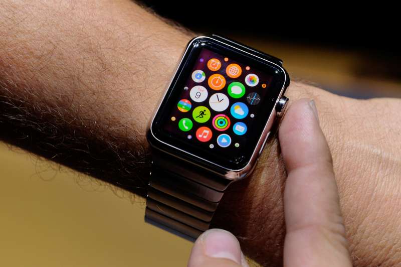 An attendee demonstrates the Apple Watch after a product announcement at Flint Center in Cupertino, California, U.S., on Tuesday, Sept. 9, 2014.