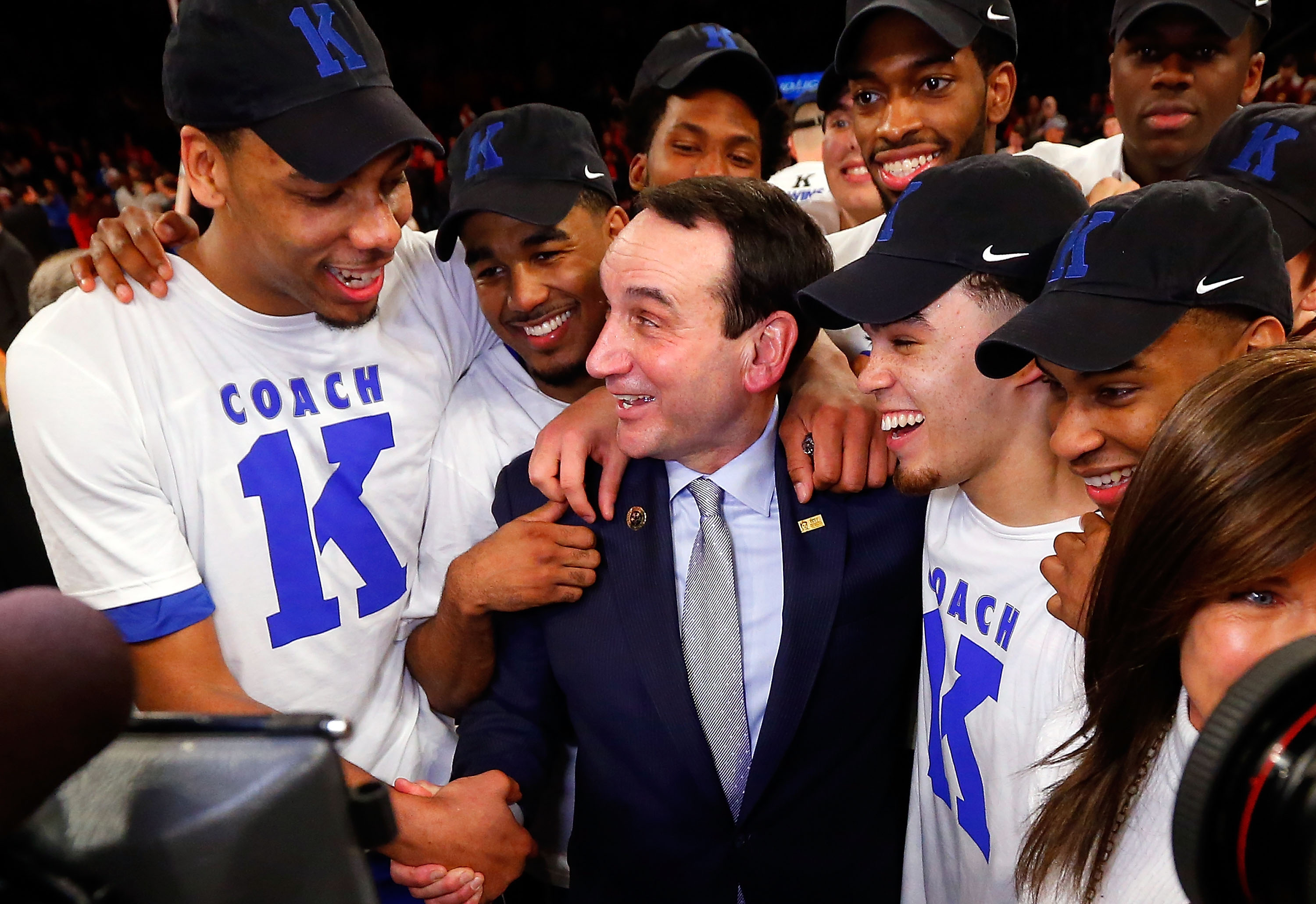 Head coach Mike Krzyzewski of the Duke Blue Devils celebrates with his players after defeating the St. John's Red Storm earning his 1,000th career victory on January 25 2015 at Madison Square Garden in New York City. Duke defeated St John's 77-68.