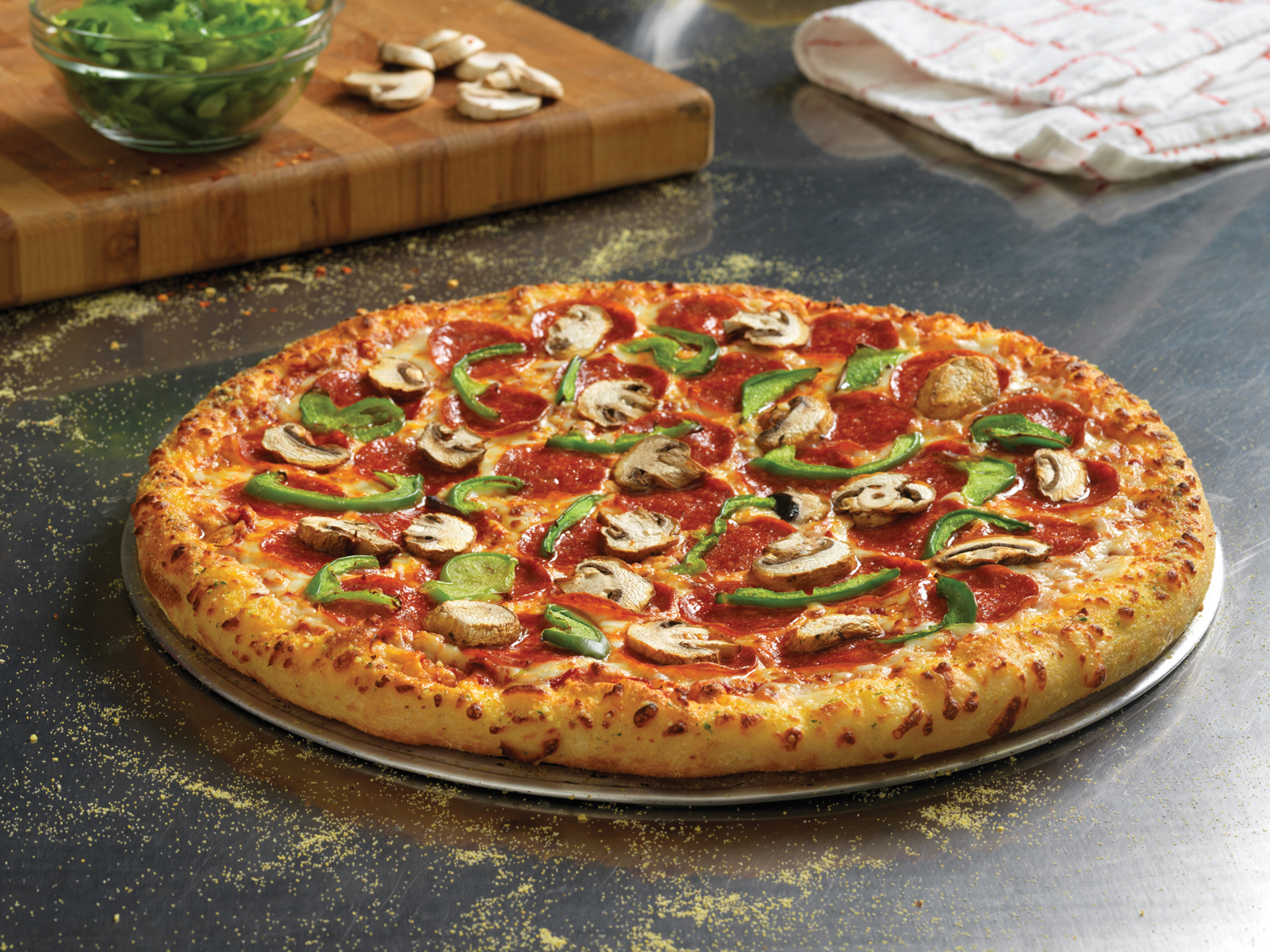Domino's hand-tossed pepperoni pizza with mushrooms and green peppers
