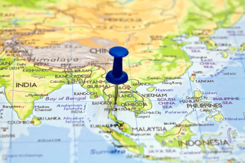 Push pin on a map showing Thailand