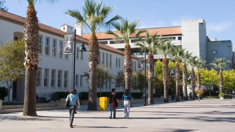 Students walking on El Paseo de Cesar Chavez street on San Jose State University campus, California