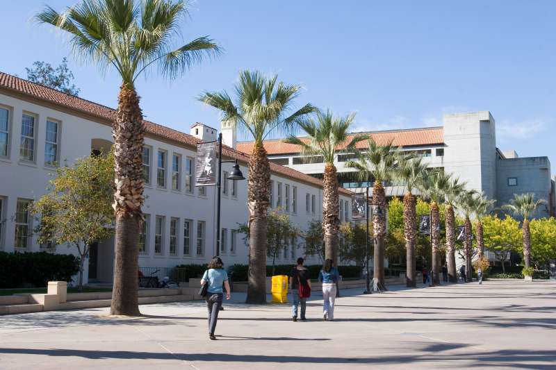 Students walking on El Paseo de Cesar Chavez street on San Jose State University campus, California