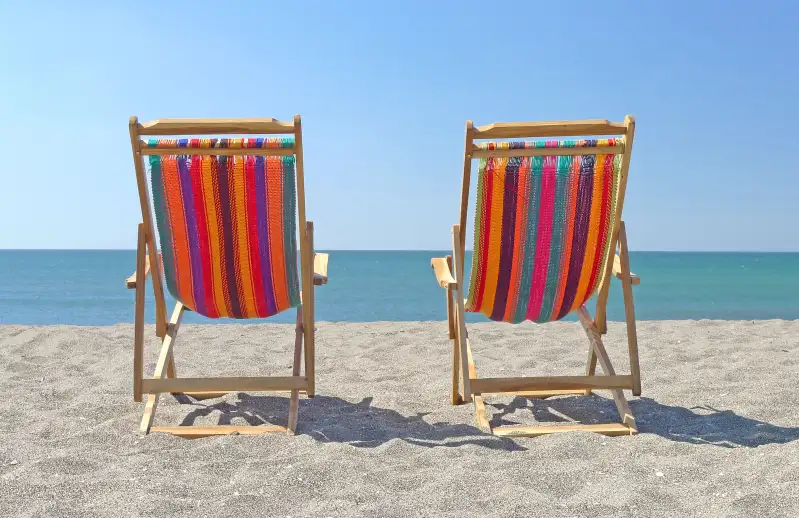 Beach chairs on sand