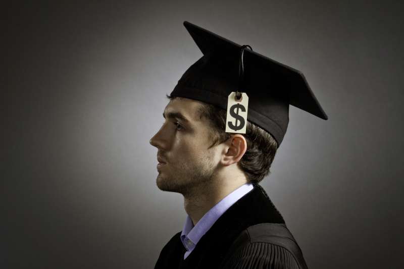 college graduate with price tag on cap
