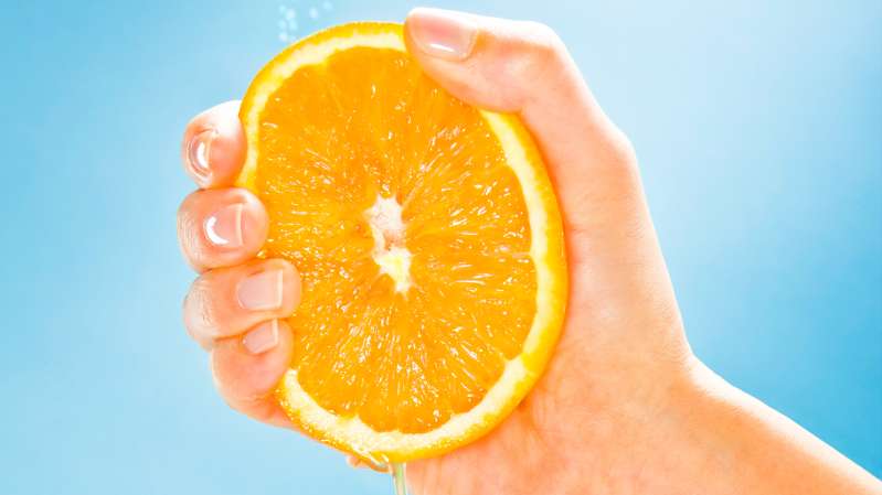 squeezing orange