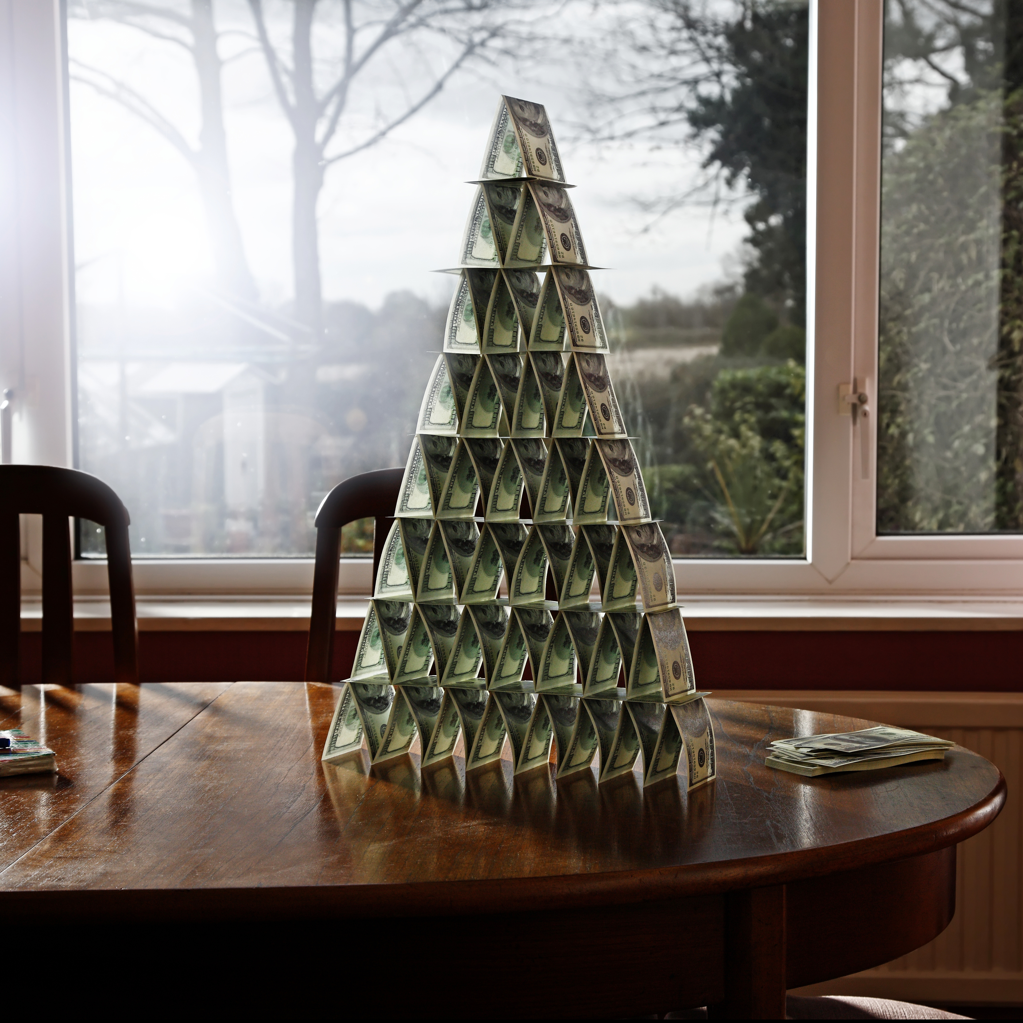 pyramid of money on table