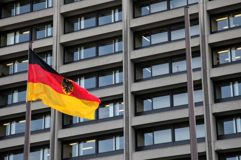 A German flag flies in front of the Bundesbank headquarters in Frankfurt, Germany.