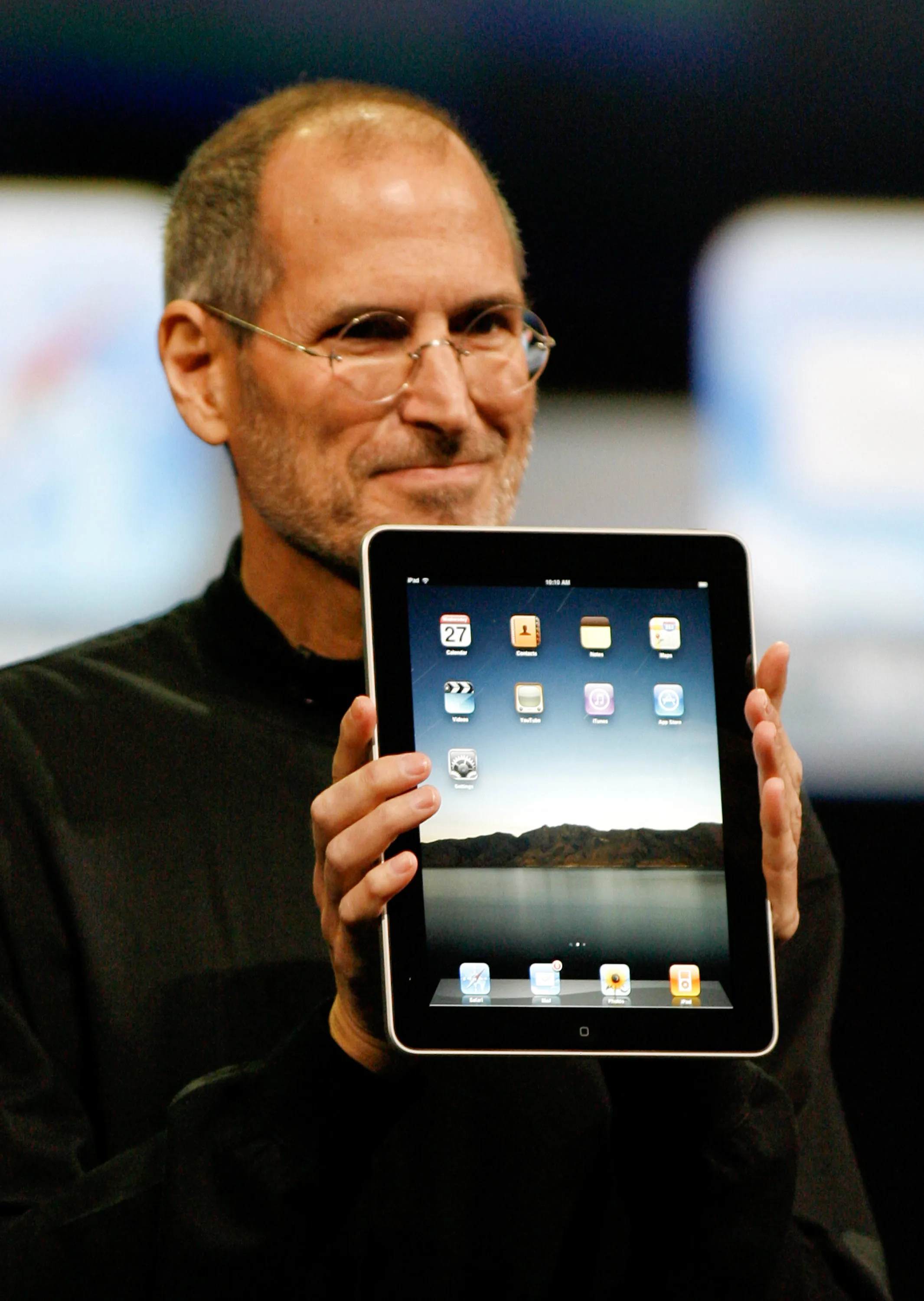 Apple CEO Steve Jobs holds an Apple iPad tablet during its debut at the Yerba Buena Center for the Arts Theater in San Francisco. The iPad would launch on April 3, 2010, with a price tag of $499.