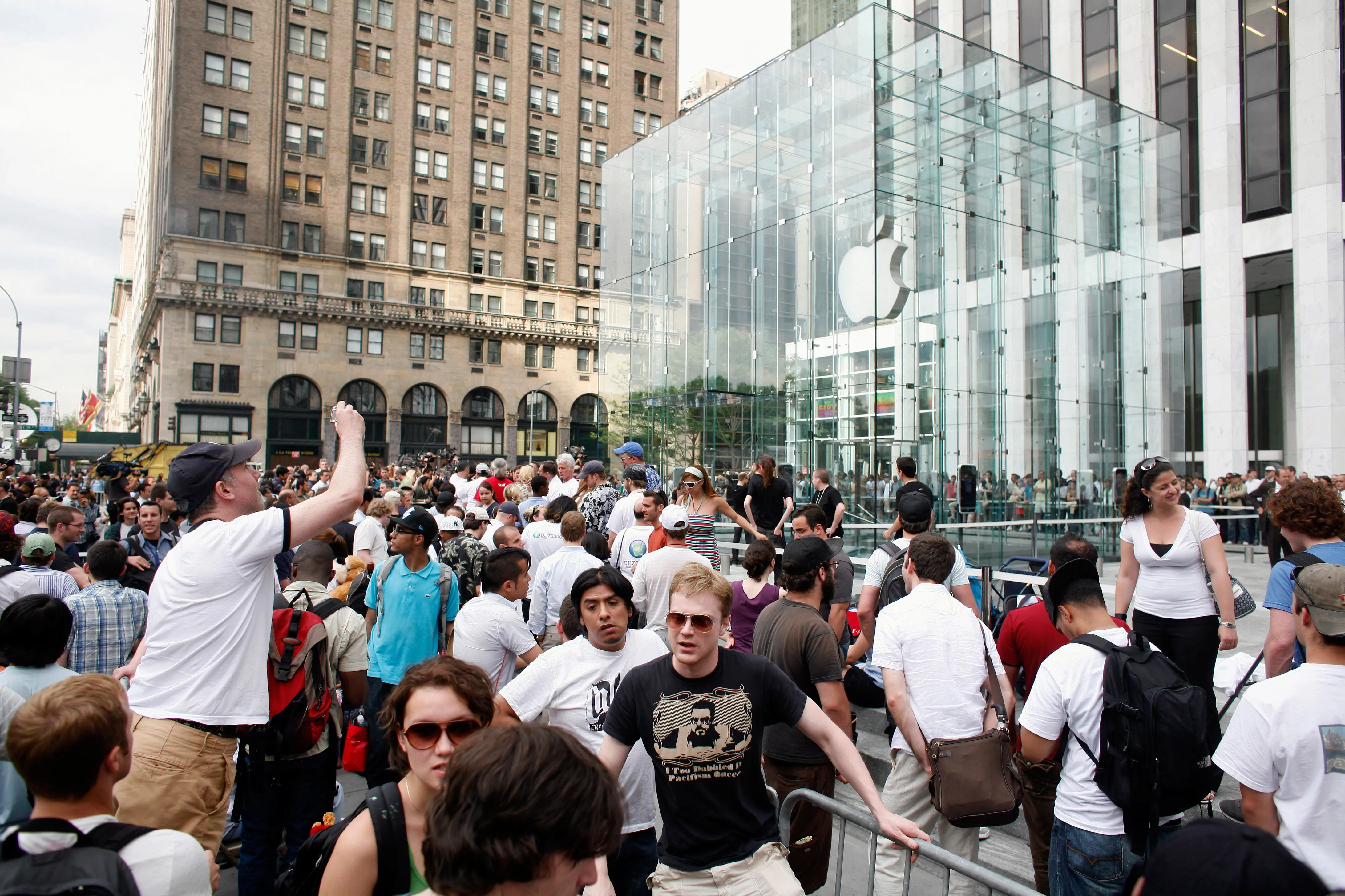 People line up to be the first to buy an iPhone at Apple's flagship store on Fifth Avenue on June 29, 2007, in New York City.