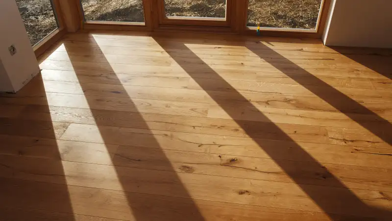 Empty room with finished parquet flooring