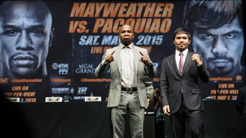 Floyd Mayweather Jr., and Manny Pacquiao strike their pose after a news conference Wednesday, March 11, 2015, in Los Angeles. Mayweather and Pacquiao are scheduled to fight on May 2 in Las Vegas.