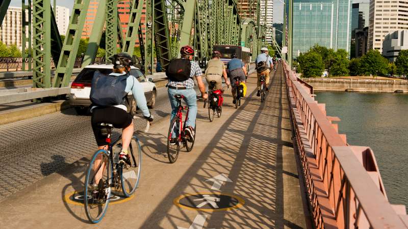 Bicycle commuters crossing the Hawthorne Bridge.