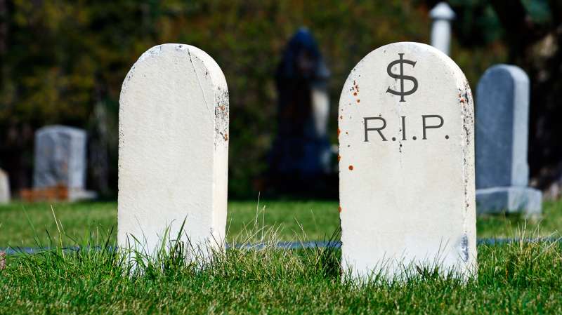 two tombstones, one saying $-RIP