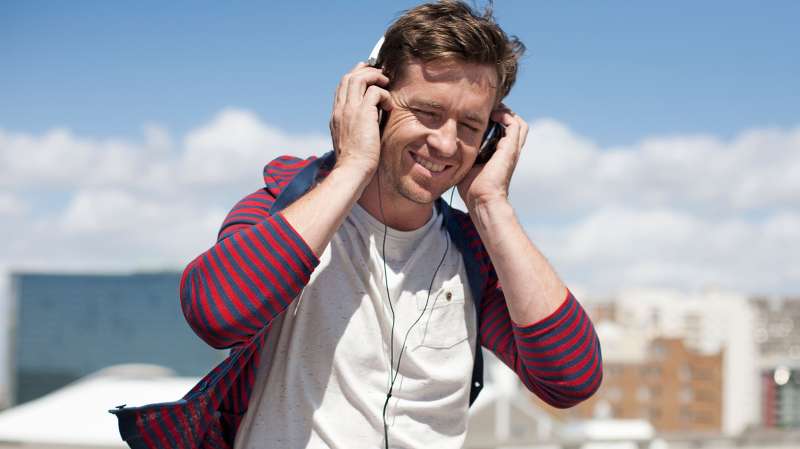 Man wearing headphones on city street
