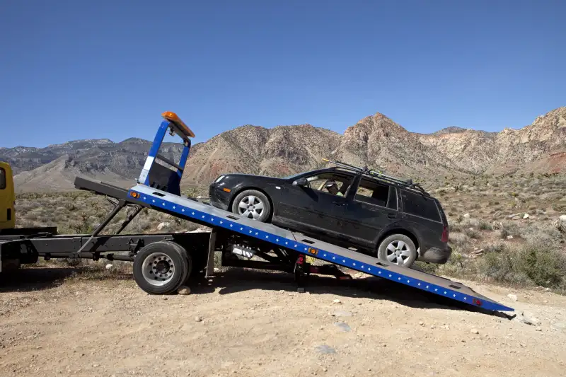 black car being towed
