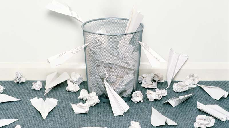 paper airplanes crashing around trashcan