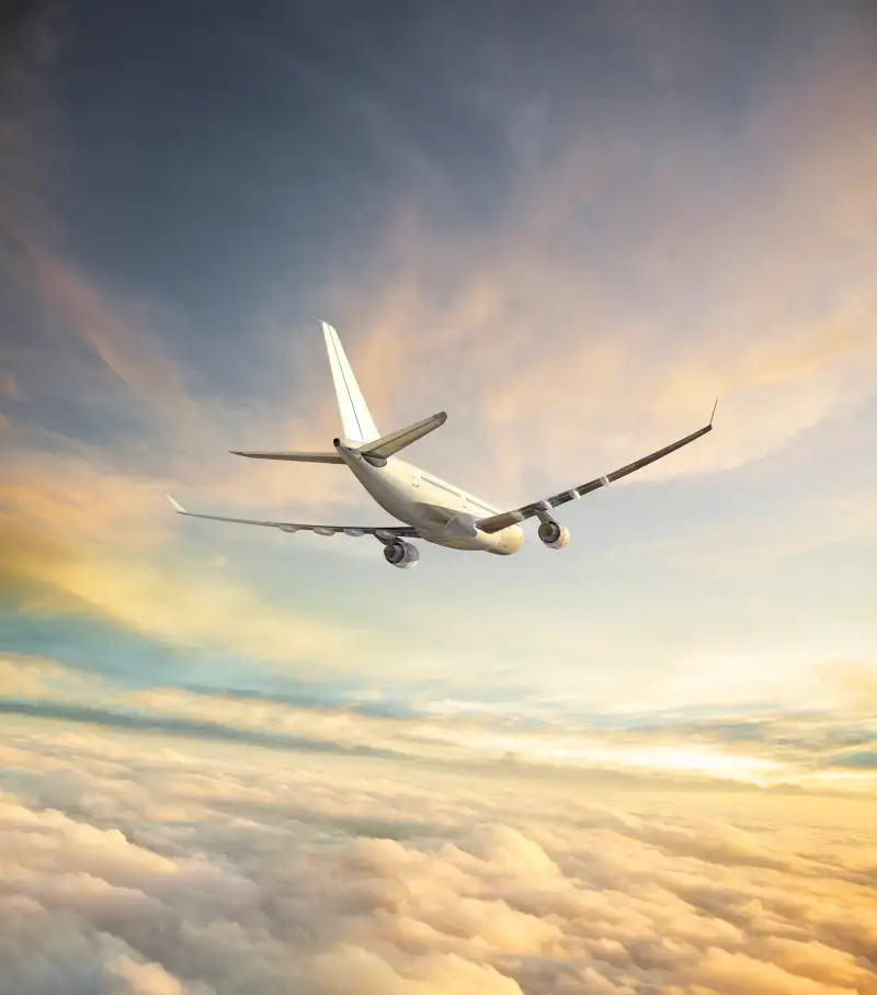 airplane in flight at dawn