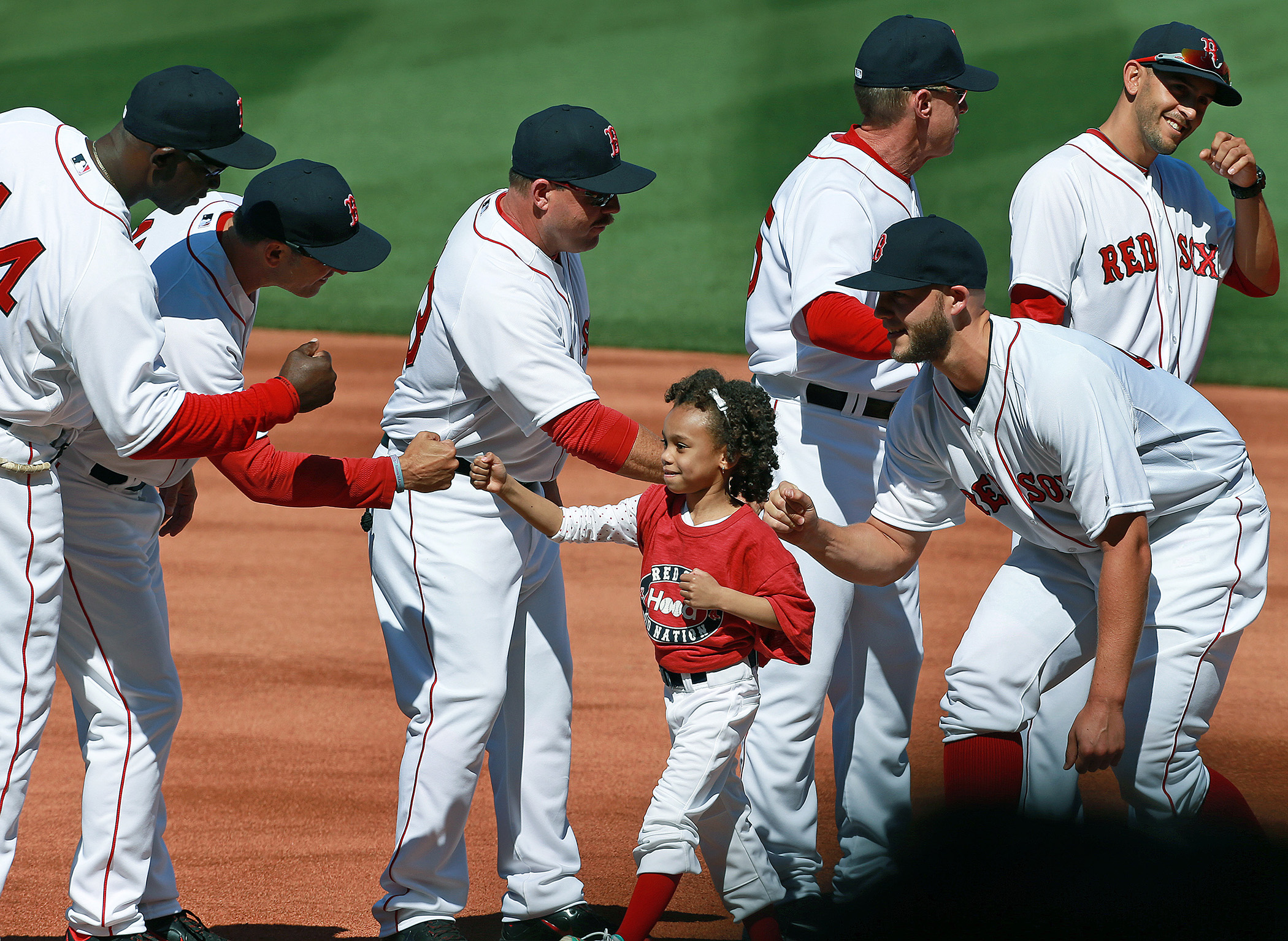 As part of a season-long program titled  Calling All Kids , the players of the Boston Red Sox were accompanied by children during pre-game introductions.